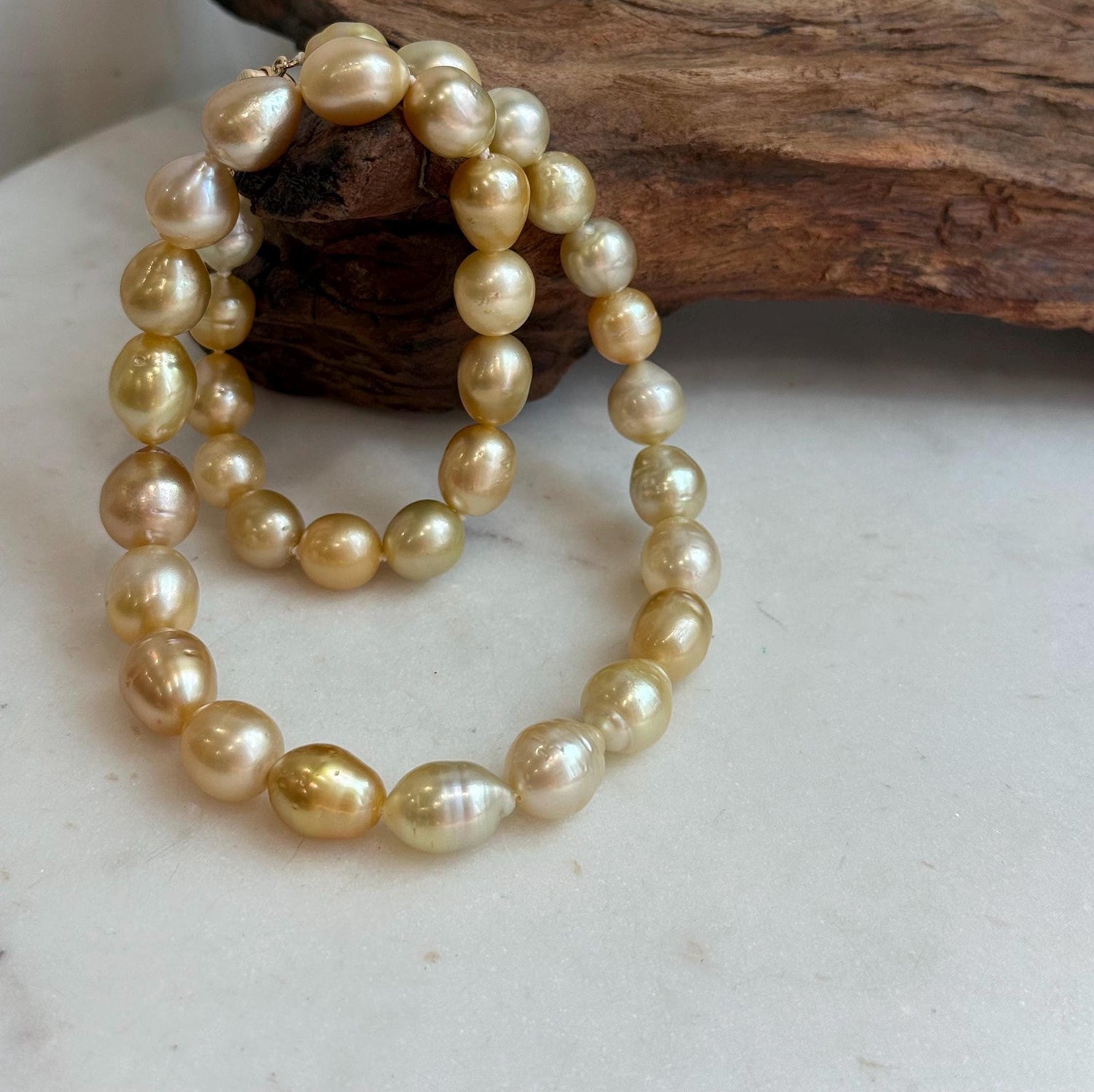 Elly’s 8.4-11.9mm 35pcs Genius natural South sea Golden Ocean Pearls Necklace: Extreme luster, 17.5” knotted, S925 silver necklace strand.