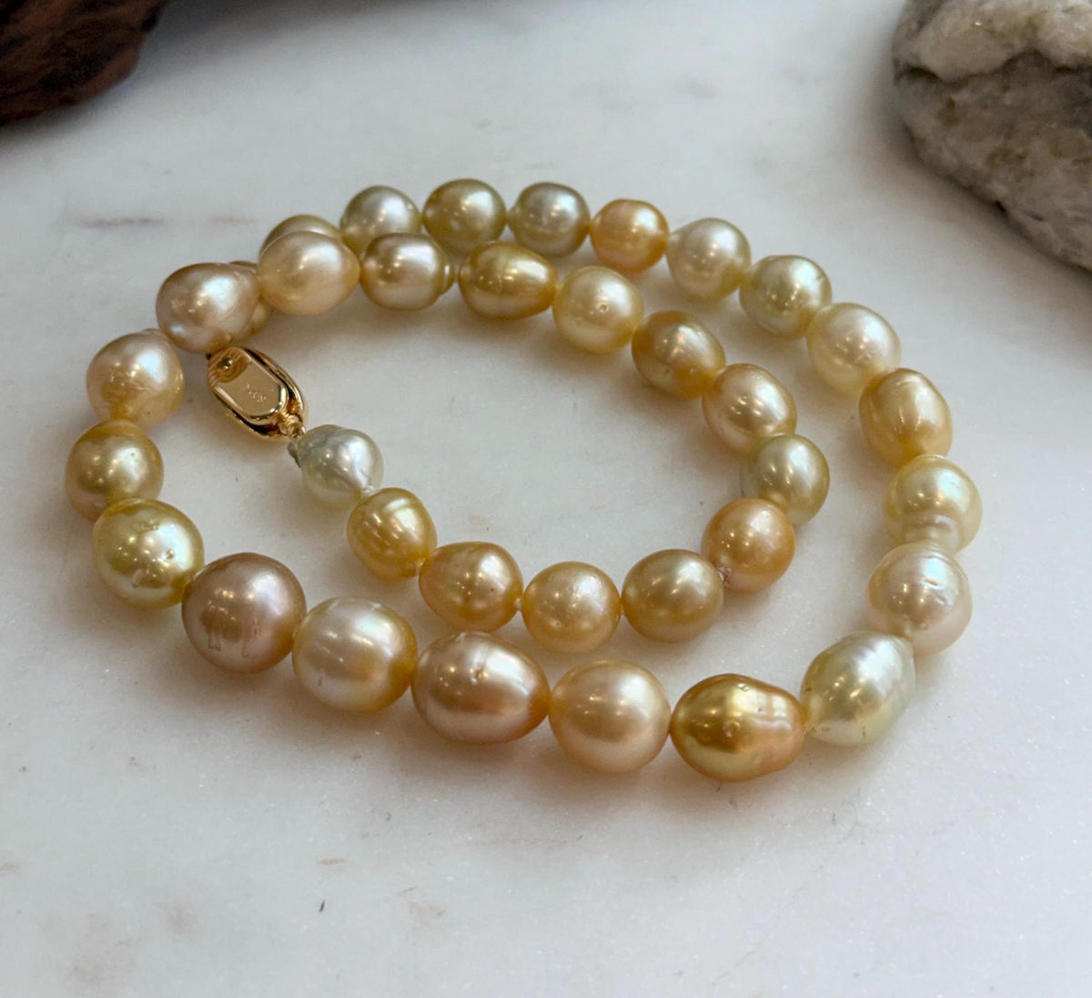Elly’s 8.4-11.9mm 35pcs Genius natural South sea Golden Ocean Pearls Necklace: Extreme luster, 17.5” knotted, S925 silver necklace strand.