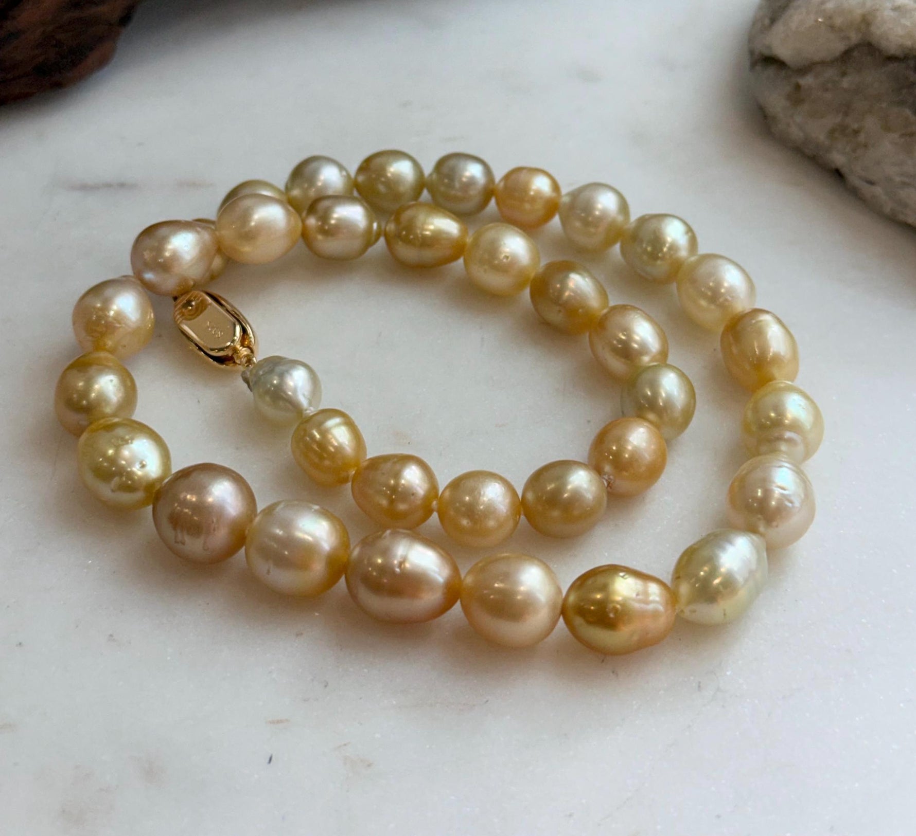 Elly’s 8.4-11.9mm 35pcs Genius natural South sea Golden Ocean Pearls Necklace: Extreme luster, 17.5” knotted, S925 silver necklace strand.