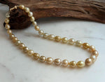 Elly’s 8.4-11.9mm 35pcs Genius natural South sea Golden Ocean Pearls Necklace: Extreme luster, 17.5” knotted, S925 silver necklace strand.