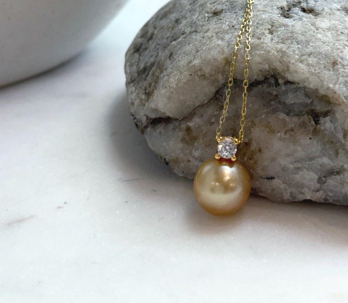 Elly’s 10.9mm South Sea deep Gold ocean Pearl pendant: Extreme luster mirrored, 1.5cm high, S925 silver w/ gold plated pendant.