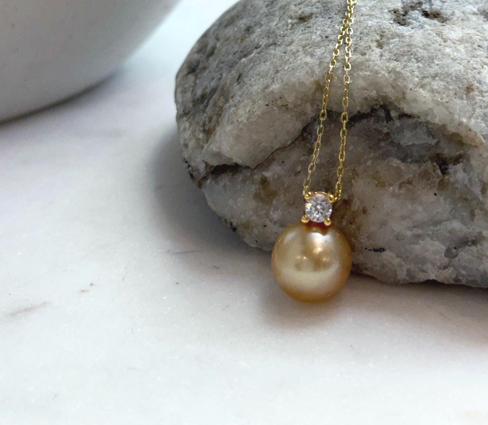 Elly’s 10.9mm South Sea deep Gold ocean Pearl pendant: Extreme luster mirrored, 1.5cm high, S925 silver w/ gold plated pendant.