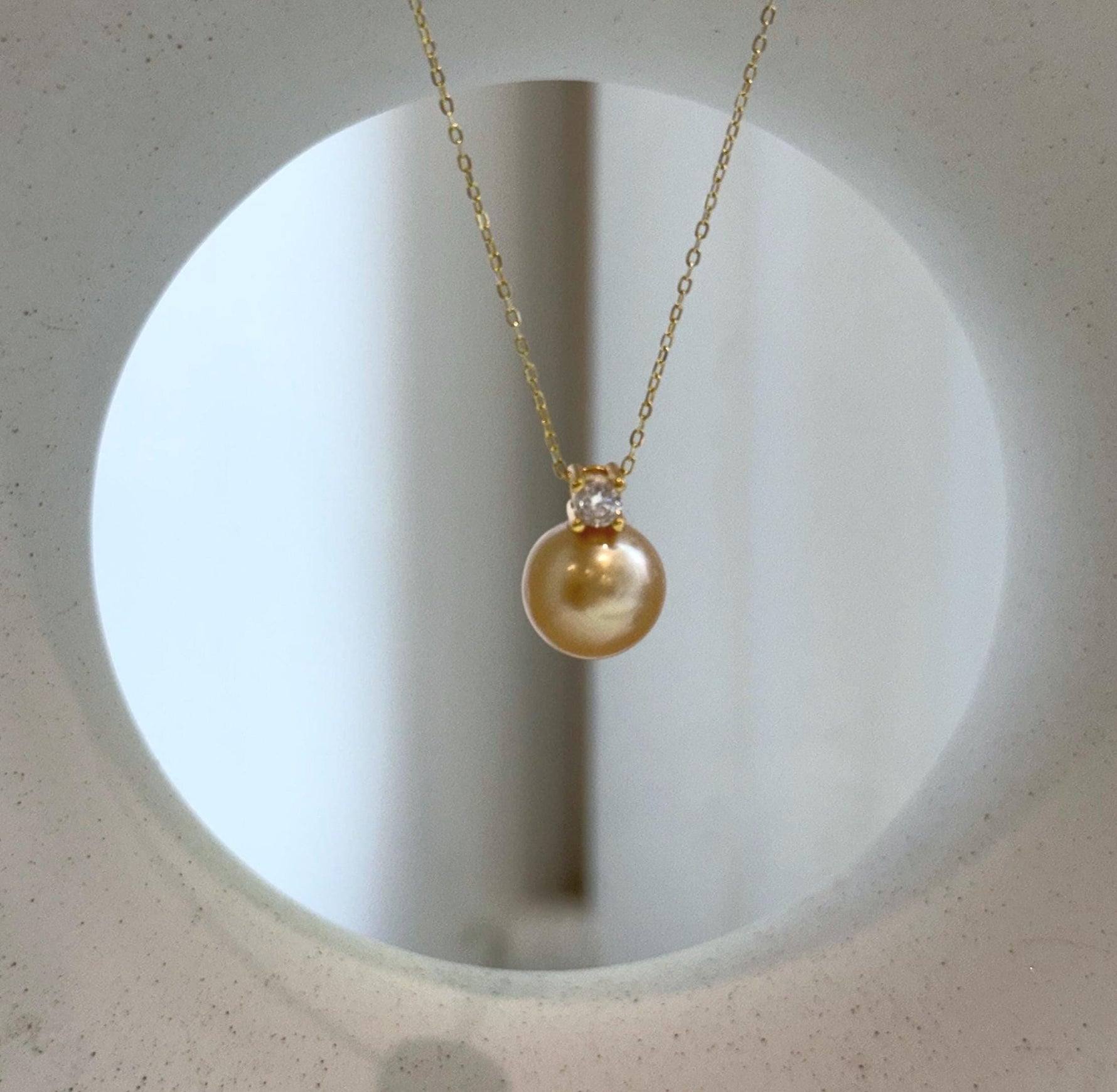 Elly’s 10.9mm South Sea deep Gold ocean Pearl pendant: Extreme luster mirrored, 1.5cm high, S925 silver w/ gold plated pendant.