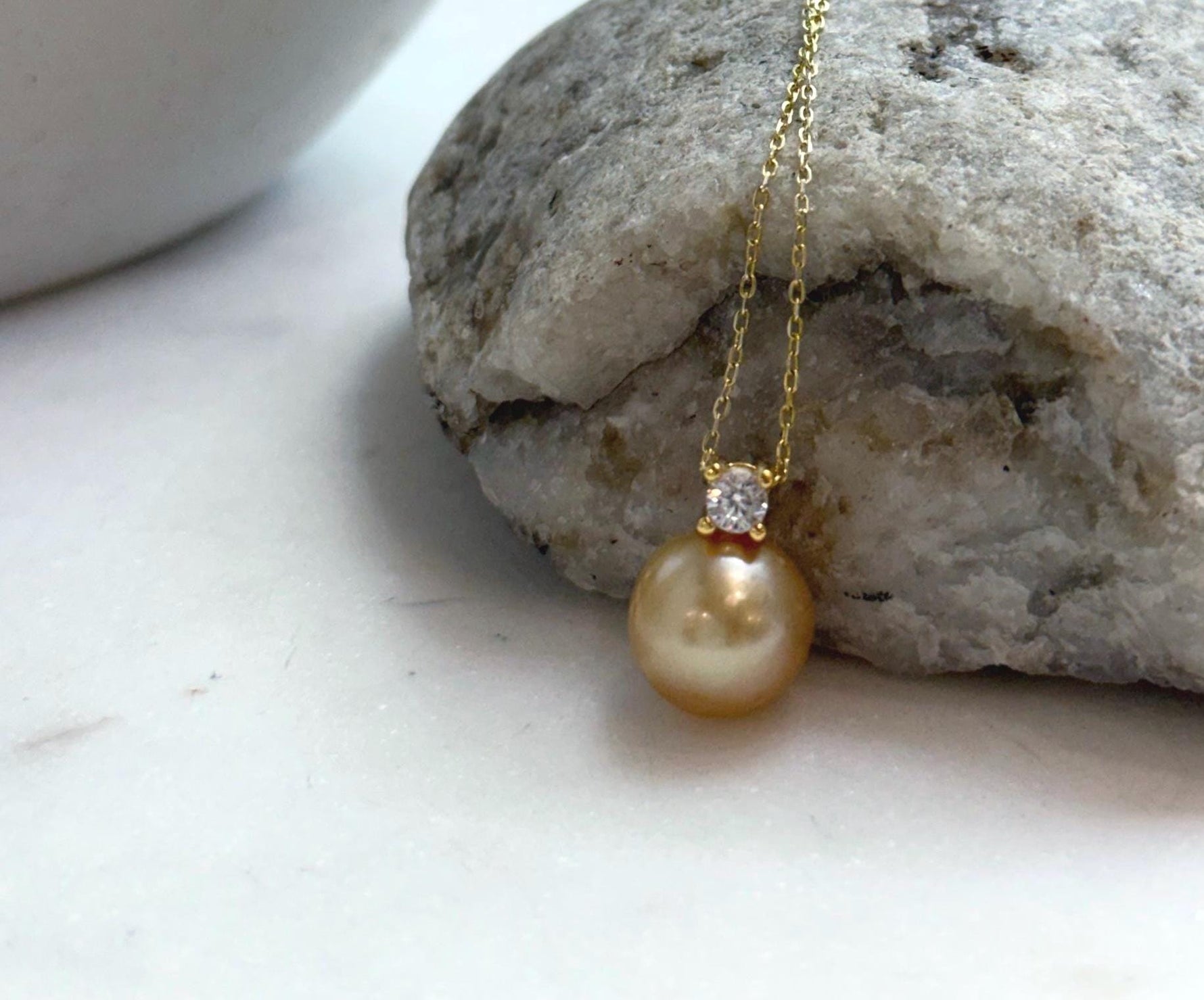 Elly’s 10.9mm South Sea deep Gold ocean Pearl pendant: Extreme luster mirrored, 1.5cm high, S925 silver w/ gold plated pendant.