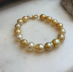 Elly’s 8.9-11.2mm 16pcs Genius South sea golden Ocean Pearls bracelet: Extreme luster, 8.1”, S925 silver bracelet.