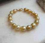 Elly’s 8.9-11.2mm 16pcs Genius South sea golden Ocean Pearls bracelet: Extreme luster, 8.1”, S925 silver bracelet.
