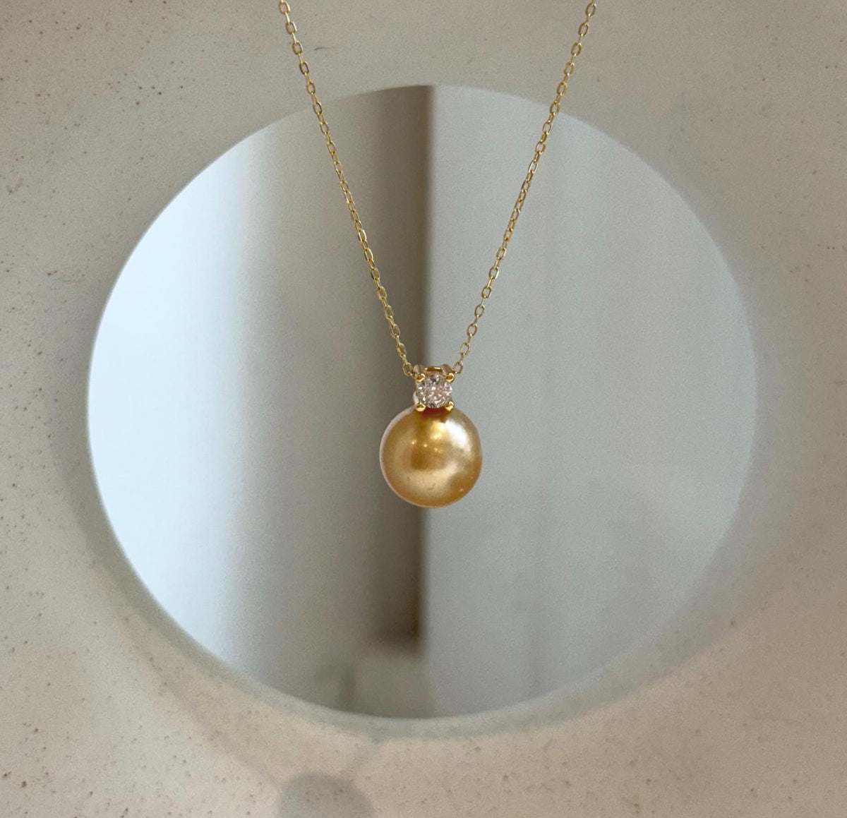 Elly’s 10.9mm South Sea deep tea Gold ocean Pearl pendant: Extreme luster mirrored, 1.5cm high, S925 silver w/ gold plated pendant.