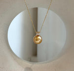 Elly’s 10.9mm South Sea deep tea Gold ocean Pearl pendant: Extreme luster mirrored, 1.5cm high, S925 silver w/ gold plated pendant.