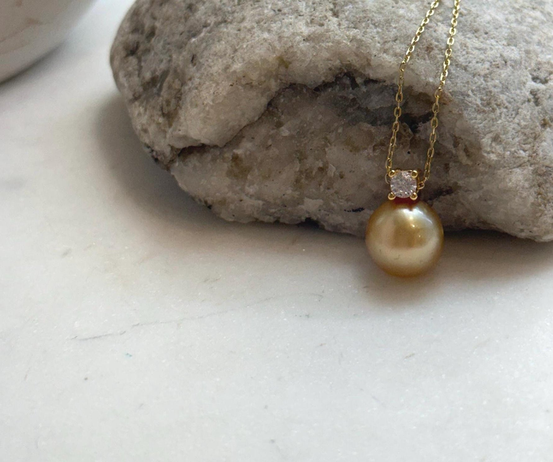 Elly’s 10.9mm South Sea deep tea Gold ocean Pearl pendant: Extreme luster mirrored, 1.5cm high, S925 silver w/ gold plated pendant.