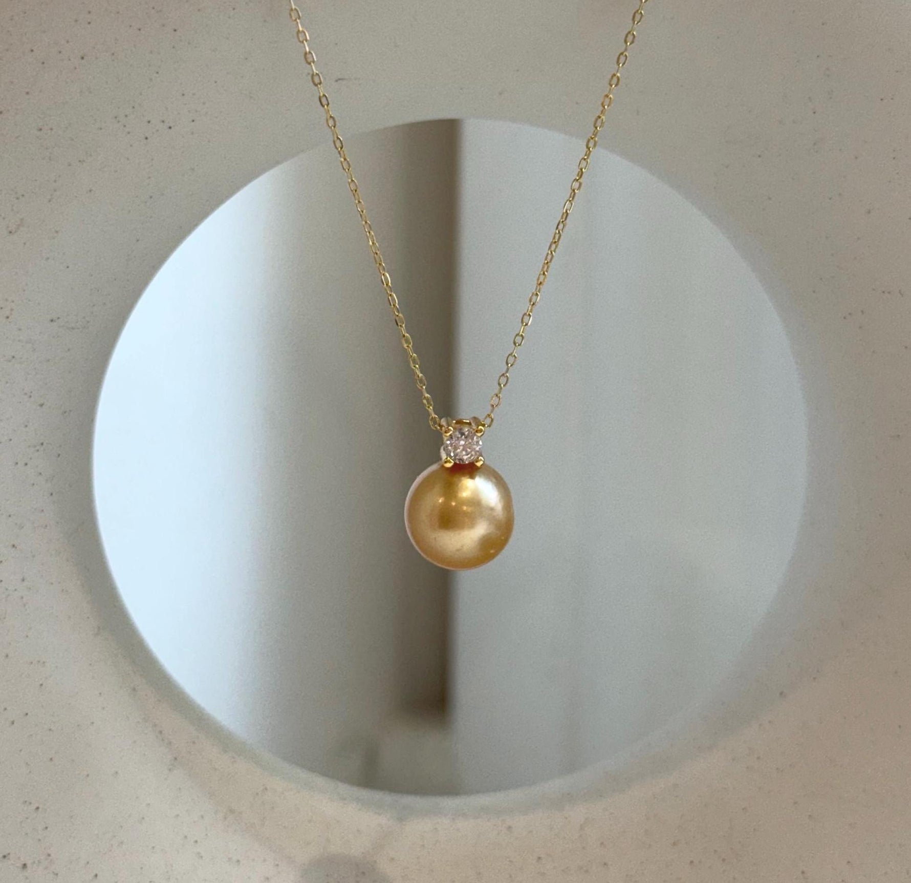 Elly’s 10.9mm South Sea deep tea Gold ocean Pearl pendant: Extreme luster mirrored, 1.5cm high, S925 silver w/ gold plated pendant.