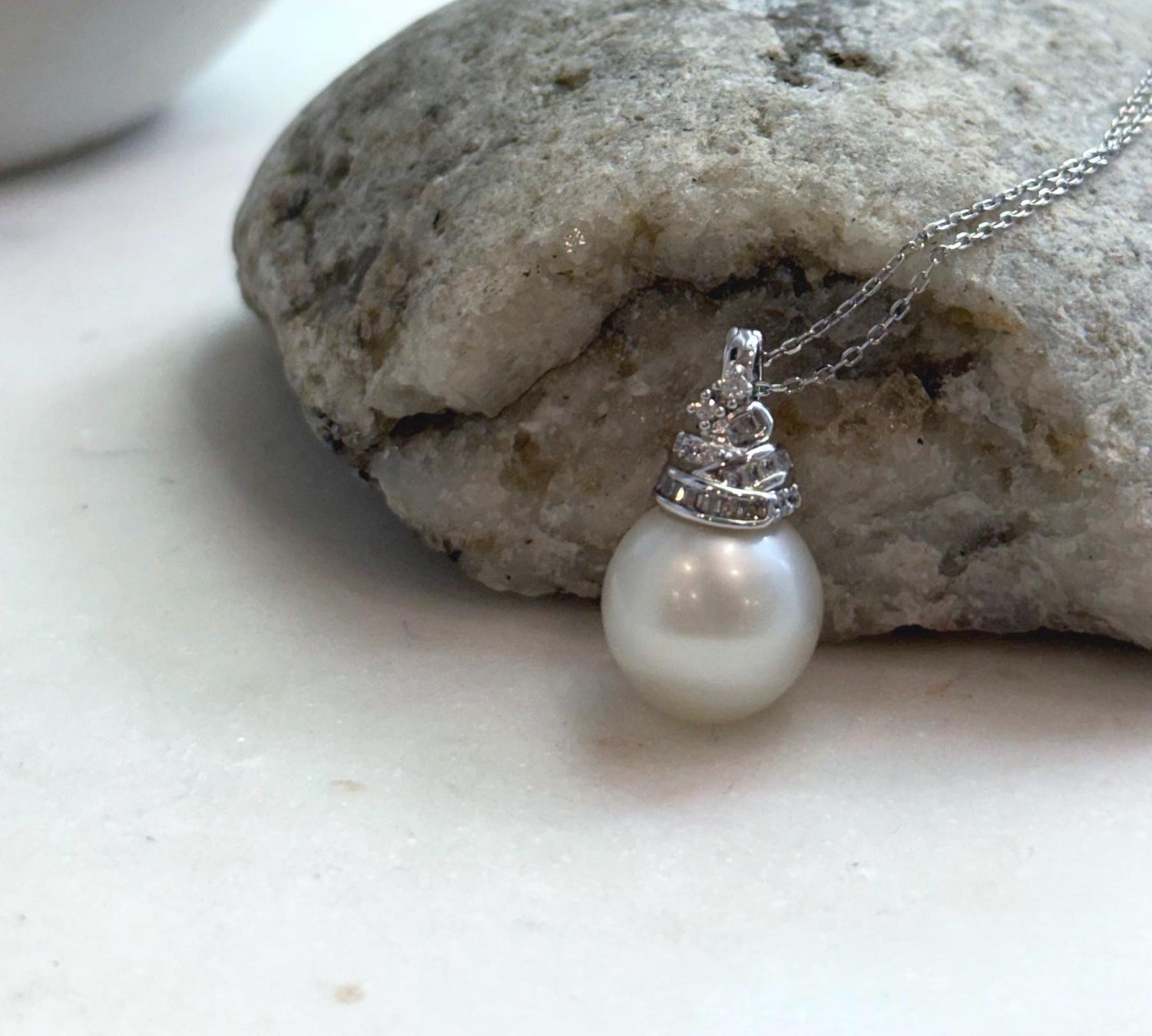 Elly’s 13.4mm South Sea White ocean Pearl pendant: Extreme luster mirrored, 2.4cm high, S925 silver w/ gold plated pendant.