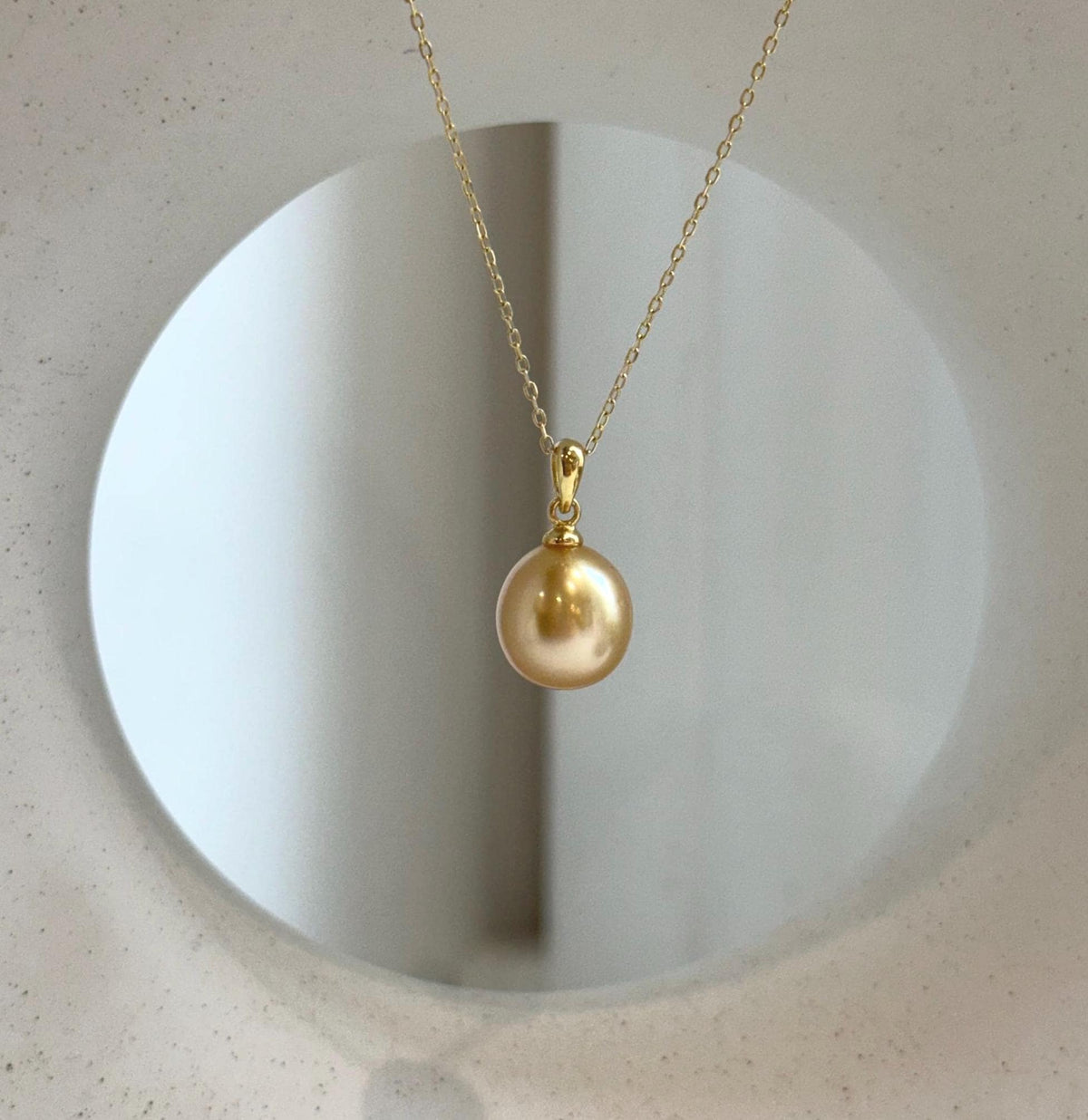 Elly’s 10.6mm South Sea deep tea Gold ocean Pearl pendant: Extreme luster mirrored, 1.9cm high, S925 silver w/ gold plated pendant.