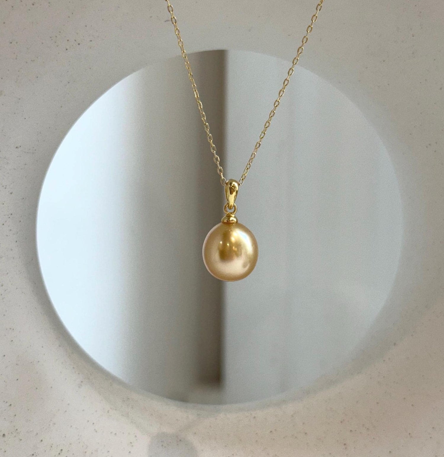 Elly’s 10.6mm South Sea deep tea Gold ocean Pearl pendant: Extreme luster mirrored, 1.9cm high, S925 silver w/ gold plated pendant.