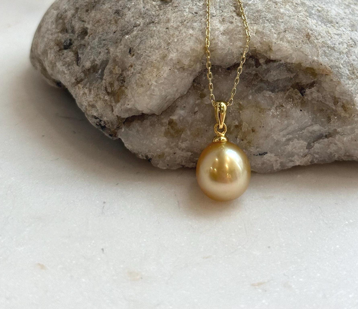 Elly’s 10.6mm South Sea deep tea Gold ocean Pearl pendant: Extreme luster mirrored, 1.9cm high, S925 silver w/ gold plated pendant.