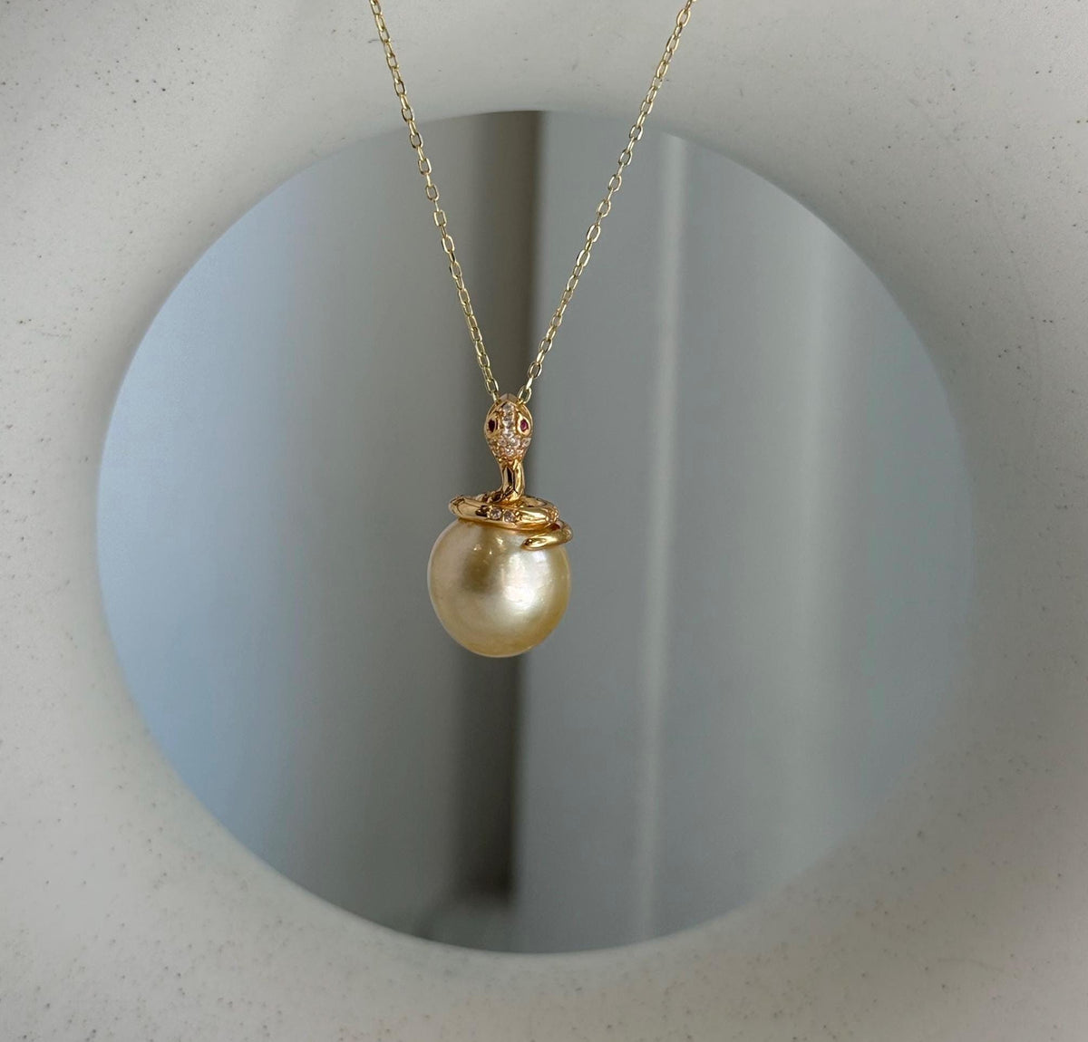 Elly’s 11.6mm South Sea Gold iridescent ocean Pearl Snake pendant: Extreme luster mirrored, 2.1cm high, S925 silver pendant.