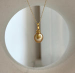 Premium South Sea deep tea gold pearl pendant showcasing a highly reflective natural pearl with an S925 sterling silver bail.