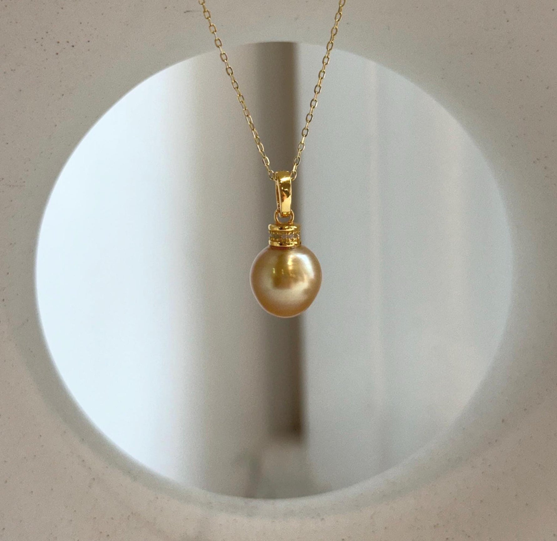 Premium South Sea deep tea gold pearl pendant showcasing a highly reflective natural pearl with an S925 sterling silver bail.