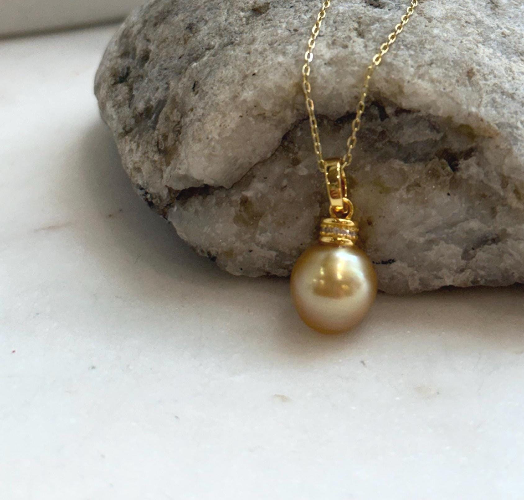 Luxury genuine South Sea pearl necklace pendant with a 10.4mm deep tea gold pearl, mirror shine, and sterling silver setting.