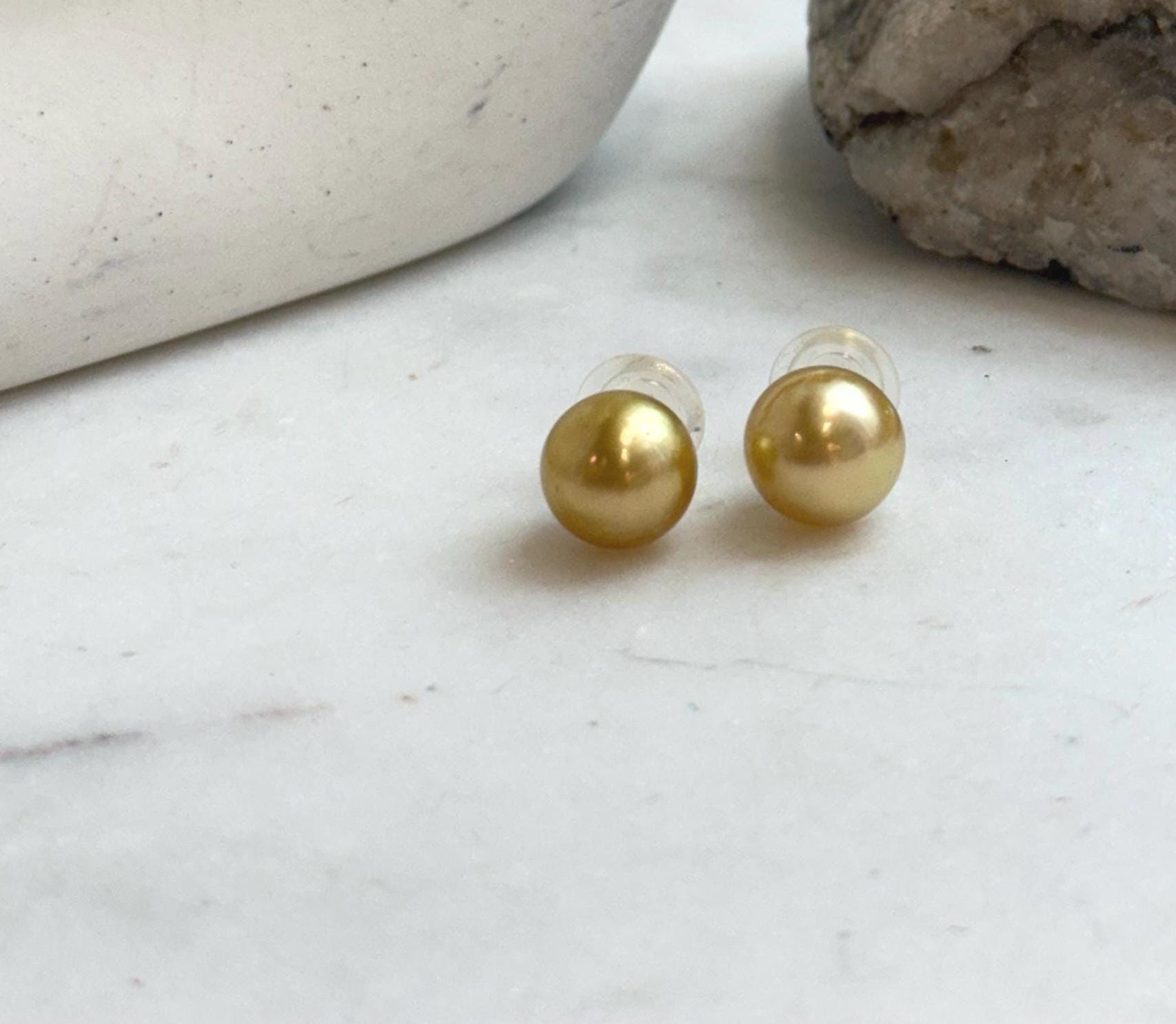 Elegant minimalist pearl earrings crafted with natural South Sea pearls.