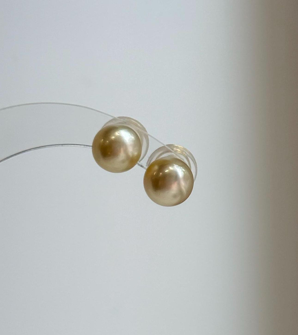 Luxury 9mm South Sea pearl studs featuring rich golden color.