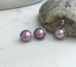 Strong luster pink Mabe pearls in sterling silver.