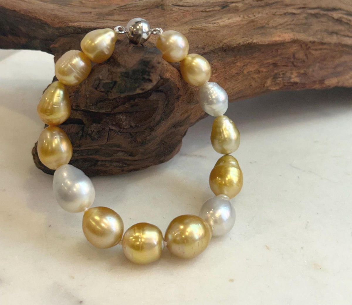 Genuine ocean pearl bracelet with sterling silver clasp.