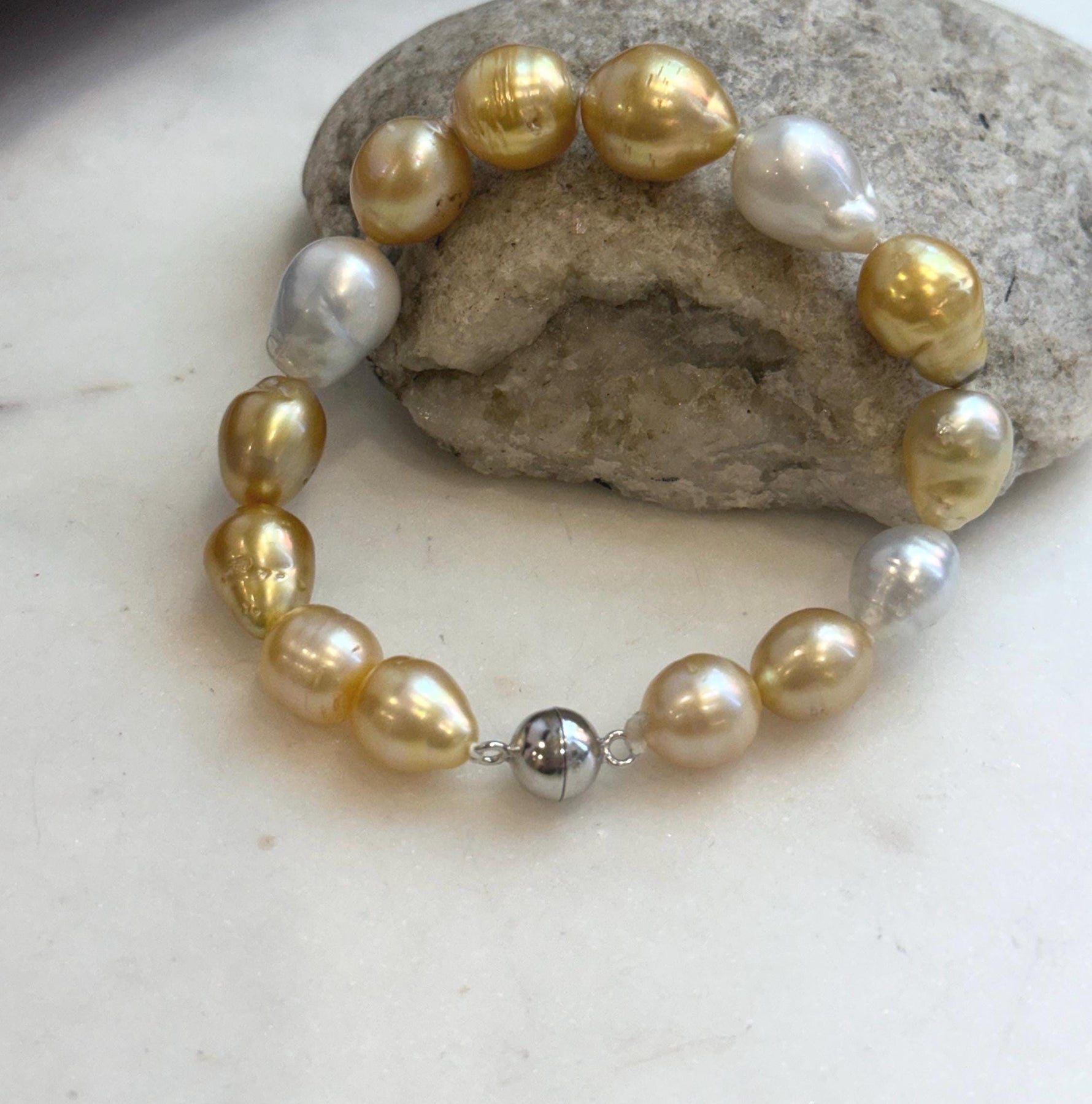 Genuine ocean pearl bracelet with sterling silver clasp.