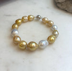 Genuine ocean pearl bracelet with sterling silver clasp.