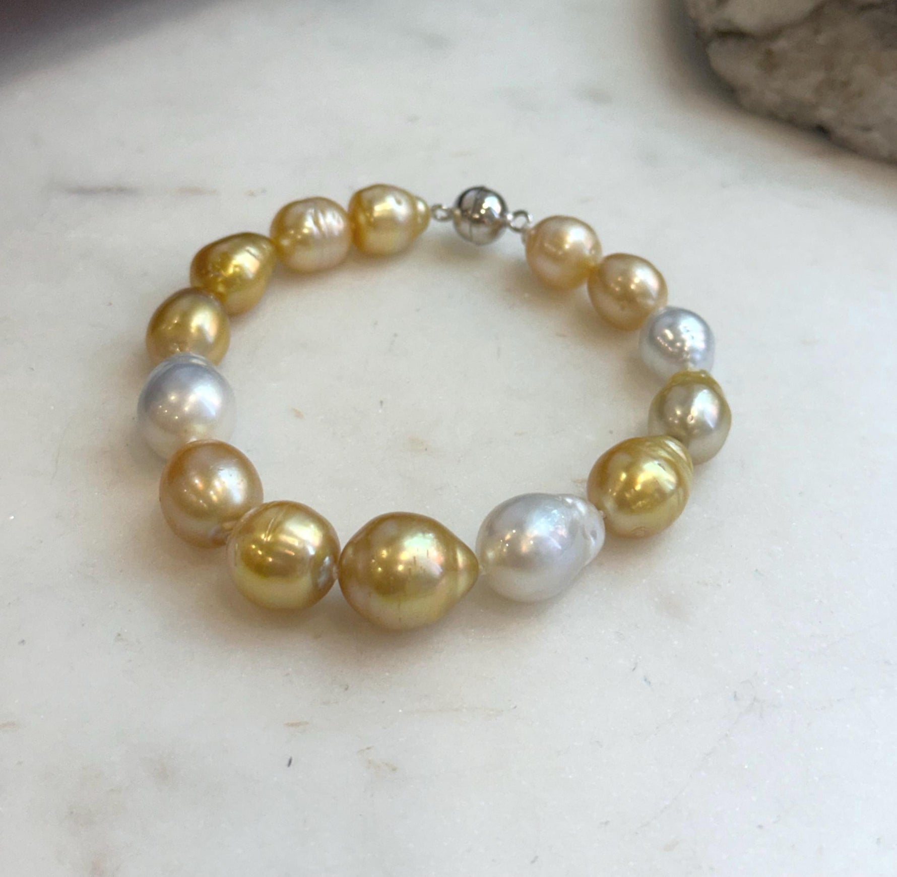 Genuine ocean pearl bracelet with sterling silver clasp.