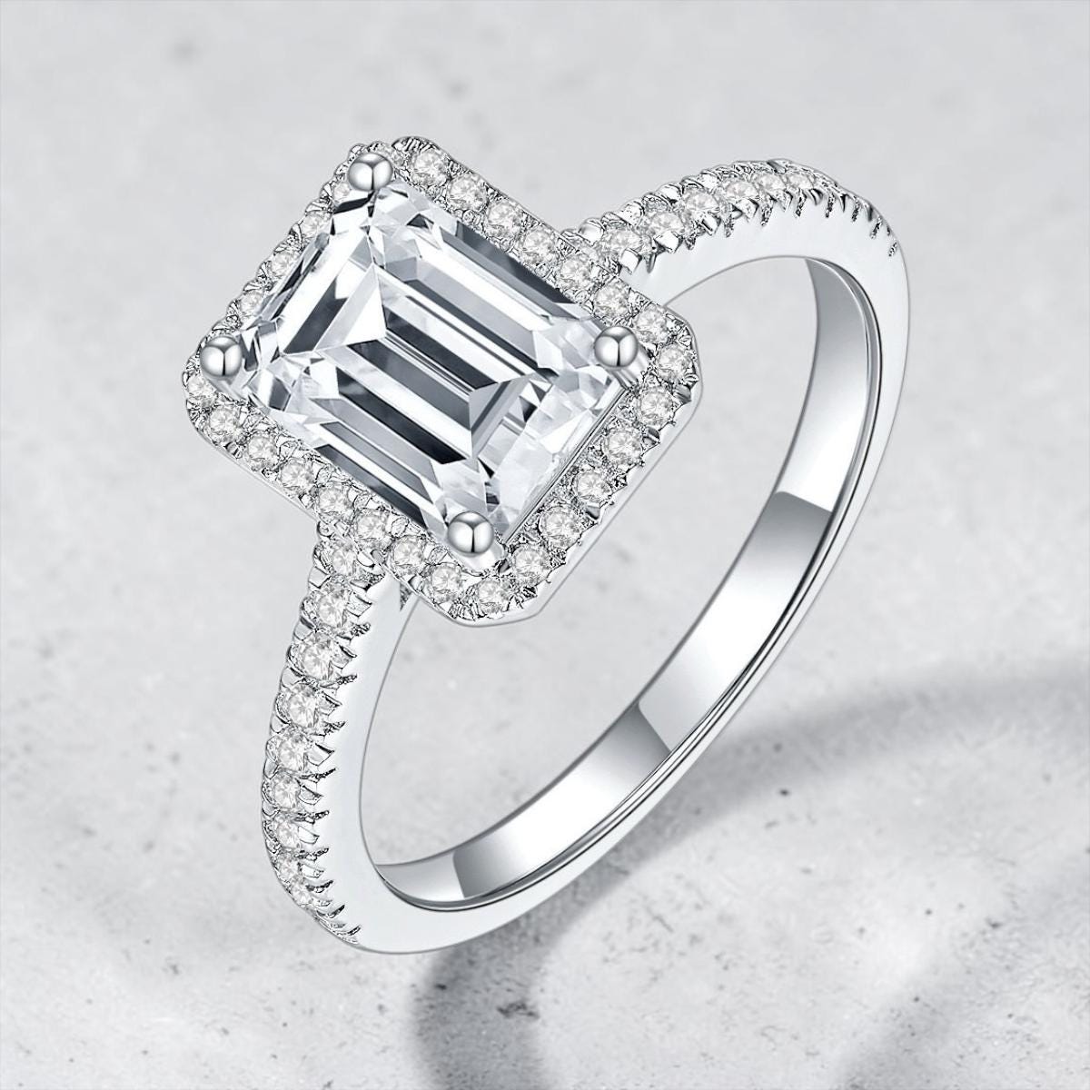 1CT emerald cut moissanite halo ring in S925 sterling silver.