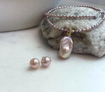 Pink rose freshwater pearl necklace with baroque pearl pendant and matching stud earrings.