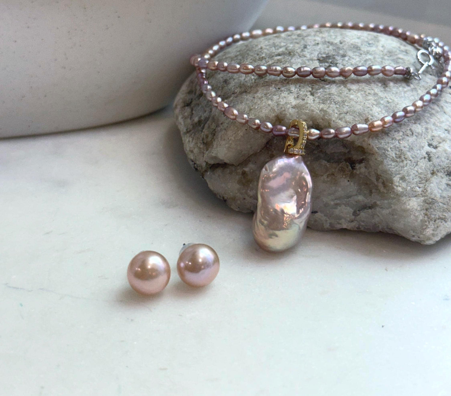 Pink rose freshwater pearl necklace with baroque pearl pendant and matching stud earrings.