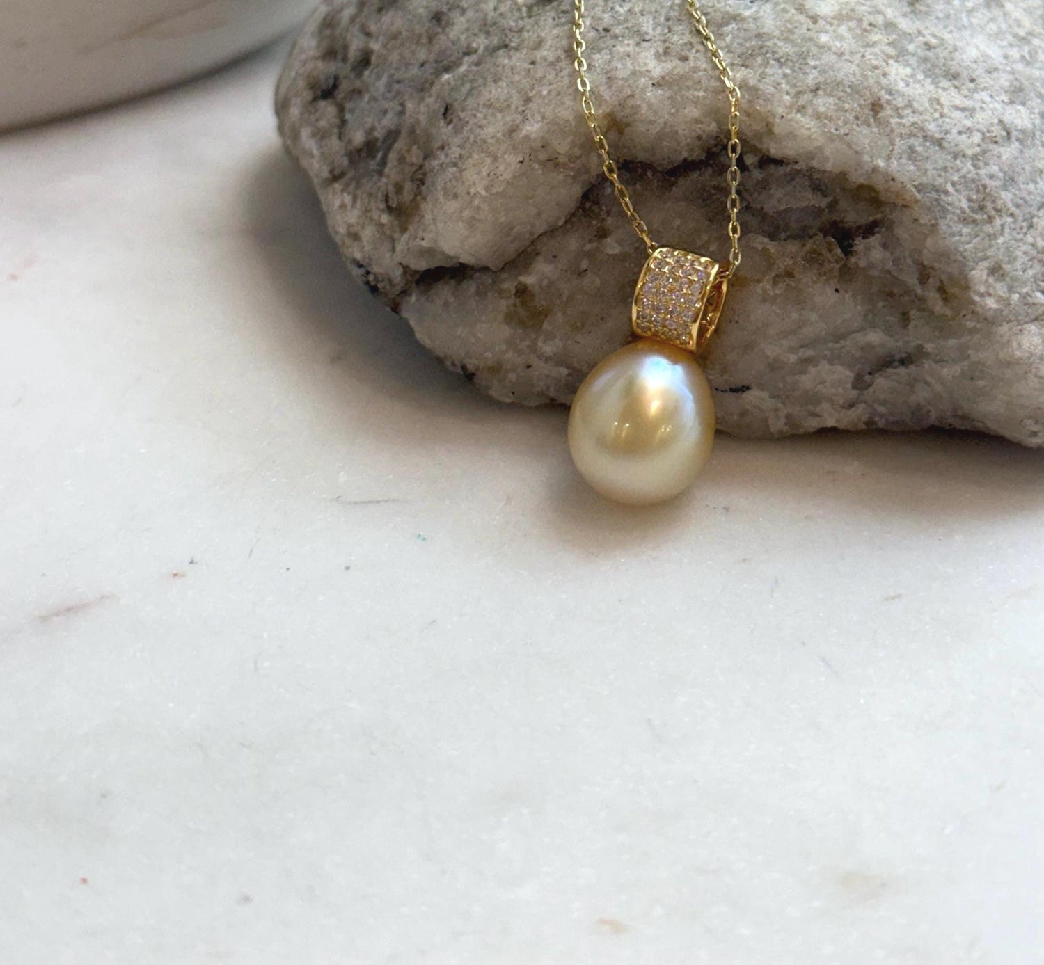 Elly’s 11.4mm South Sea Golden iridescent ocean Pearl pendant: Extreme luster mirrored, 2cm high, S925 silver w/ gold plated pendant.