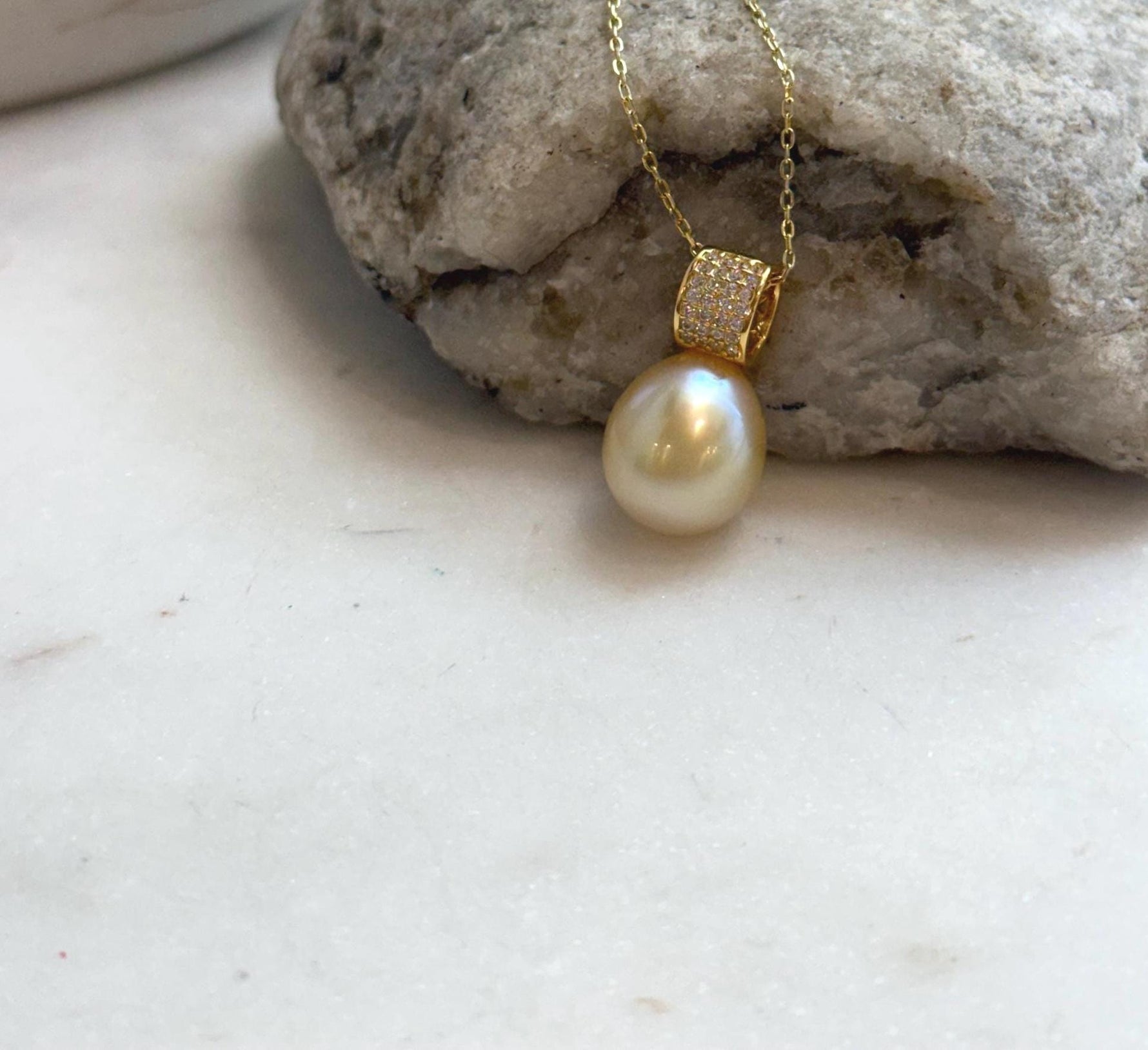 Elly’s 11.4mm South Sea Golden iridescent ocean Pearl pendant: Extreme luster mirrored, 2cm high, S925 silver w/ gold plated pendant.