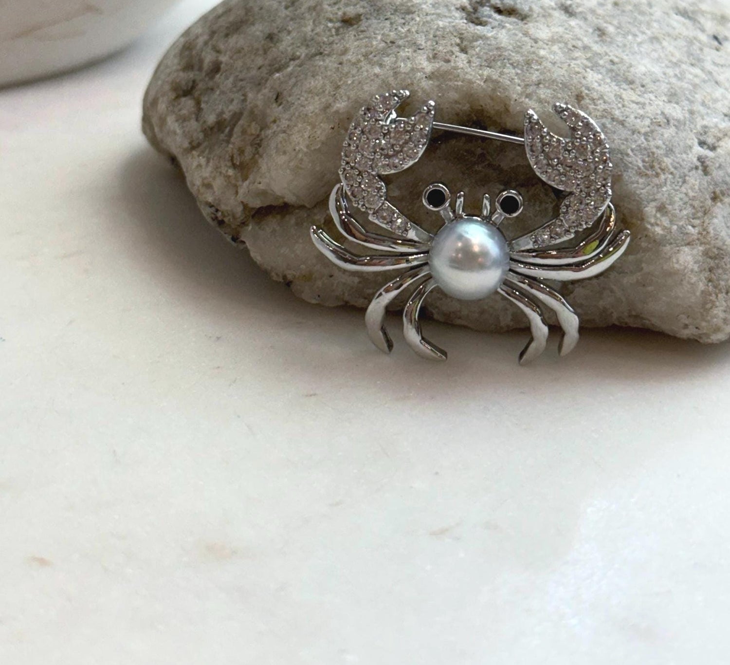 Elly’s 8.9mm Akoya ocean pearl Crab brooch: Extreme luster mirrored, 3.7x3cm, no chain.