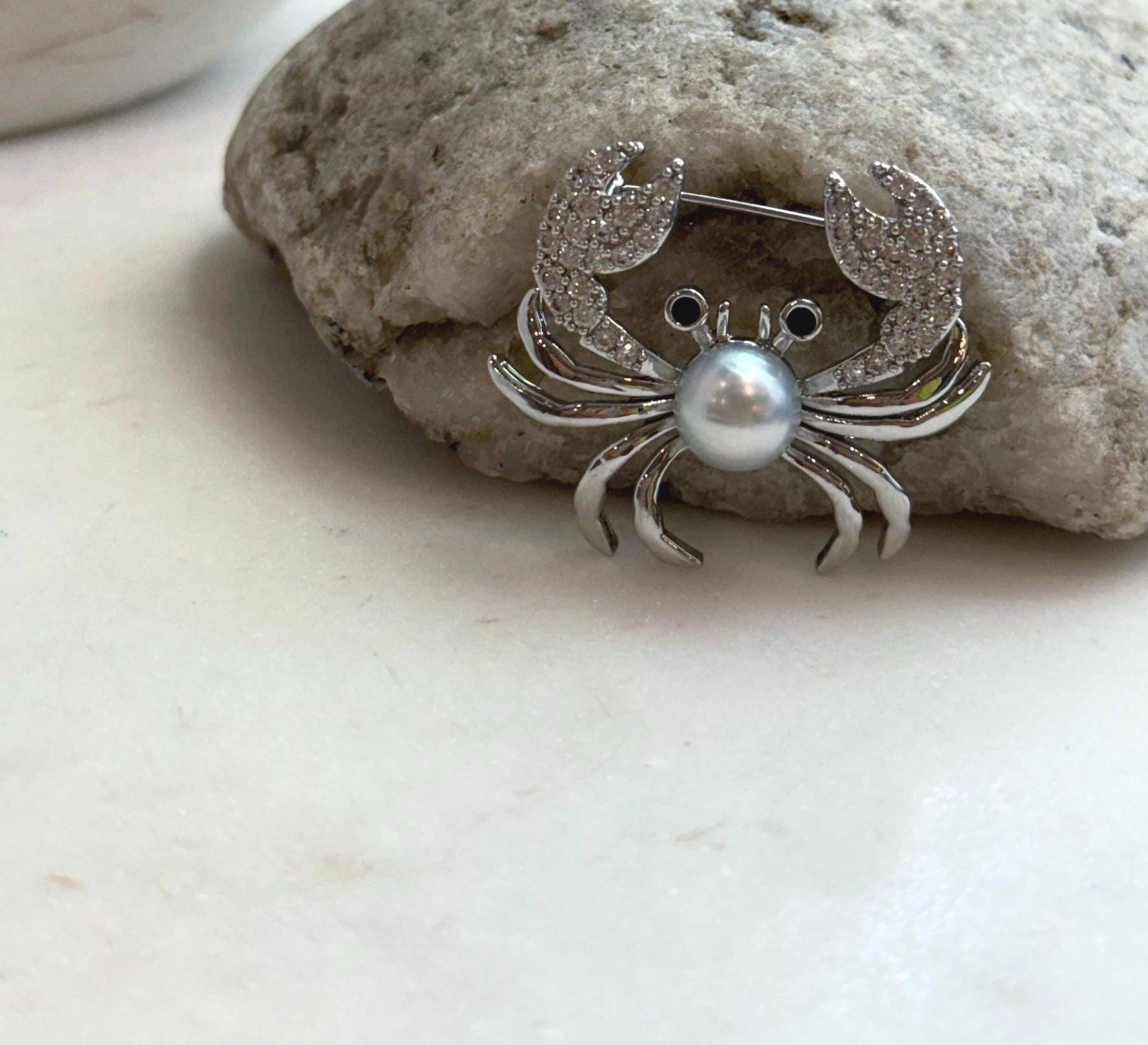 Elly’s 8.9mm Akoya ocean pearl Crab brooch: Extreme luster mirrored, 3.7x3cm, no chain.