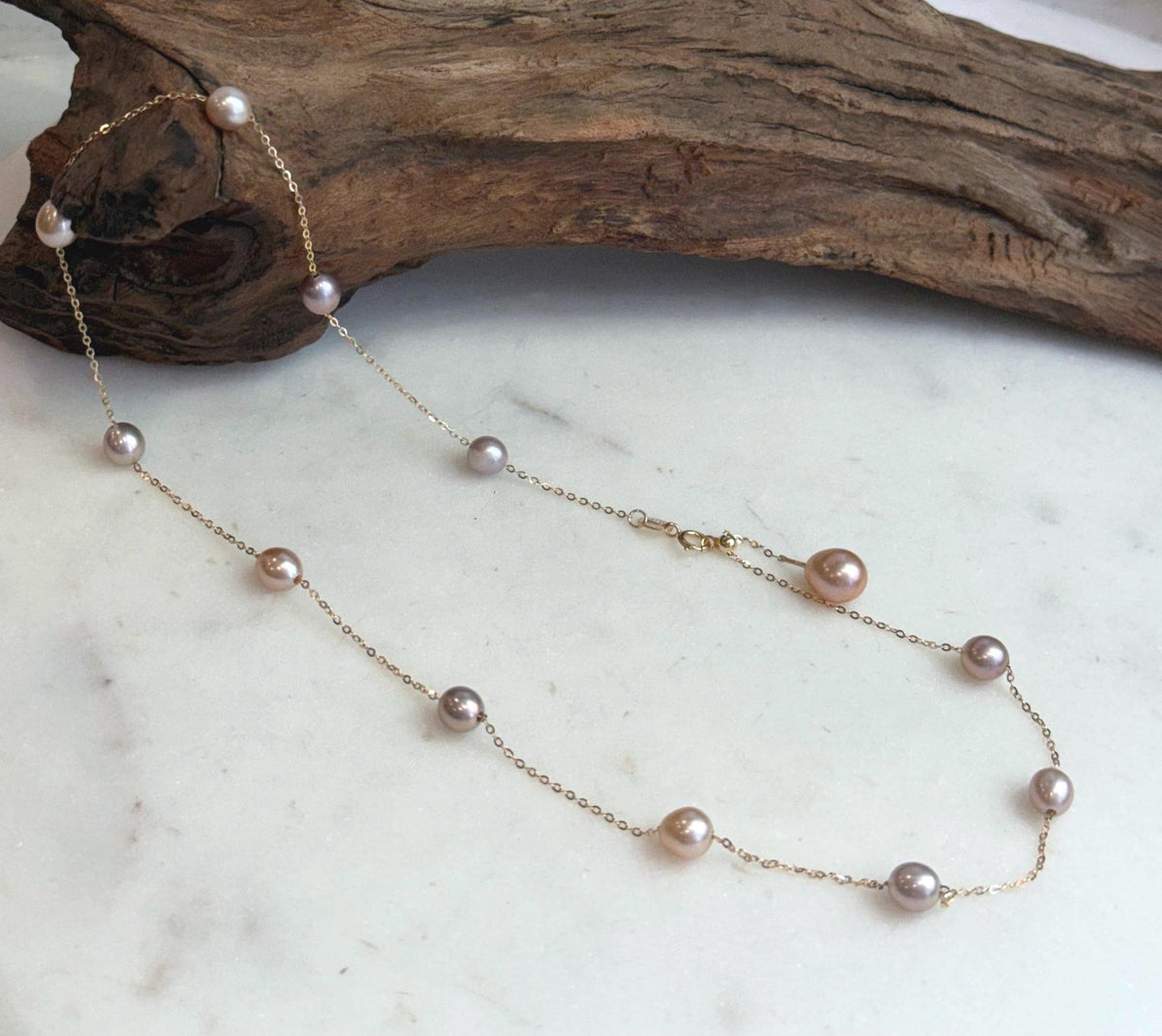 S925 sterling silver necklace set with Akoya pearl pendant and natural freshwater Keshi pearls.