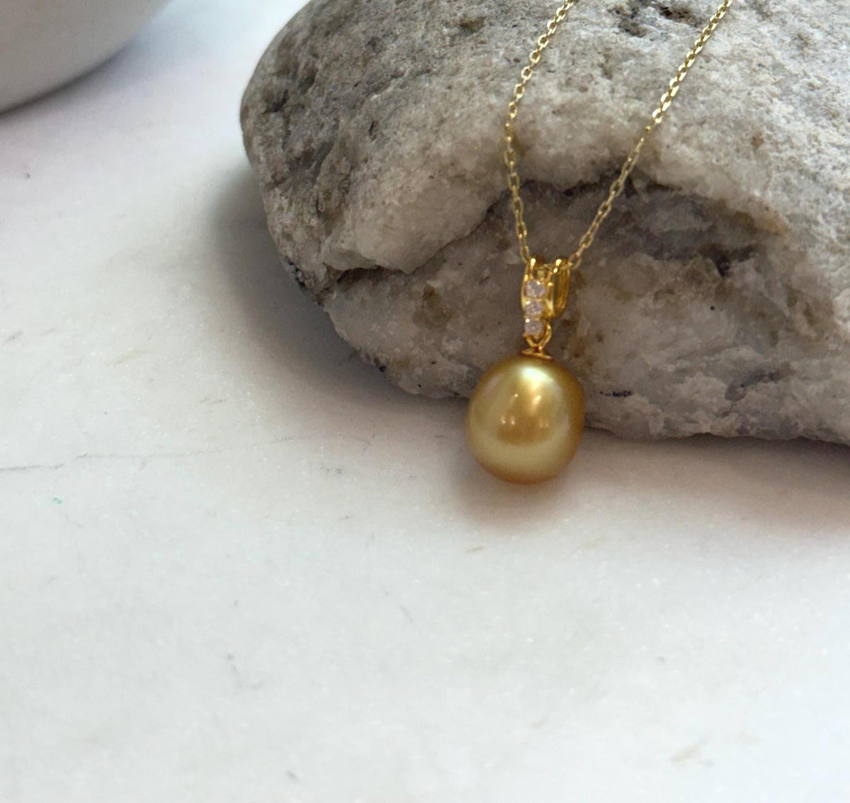 Luxury 10.2mm South Sea gold pearl pendant with mirror-like luster on S925 silver setting.