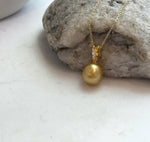 Luxury 10.2mm South Sea gold pearl pendant with mirror-like luster on S925 silver setting.