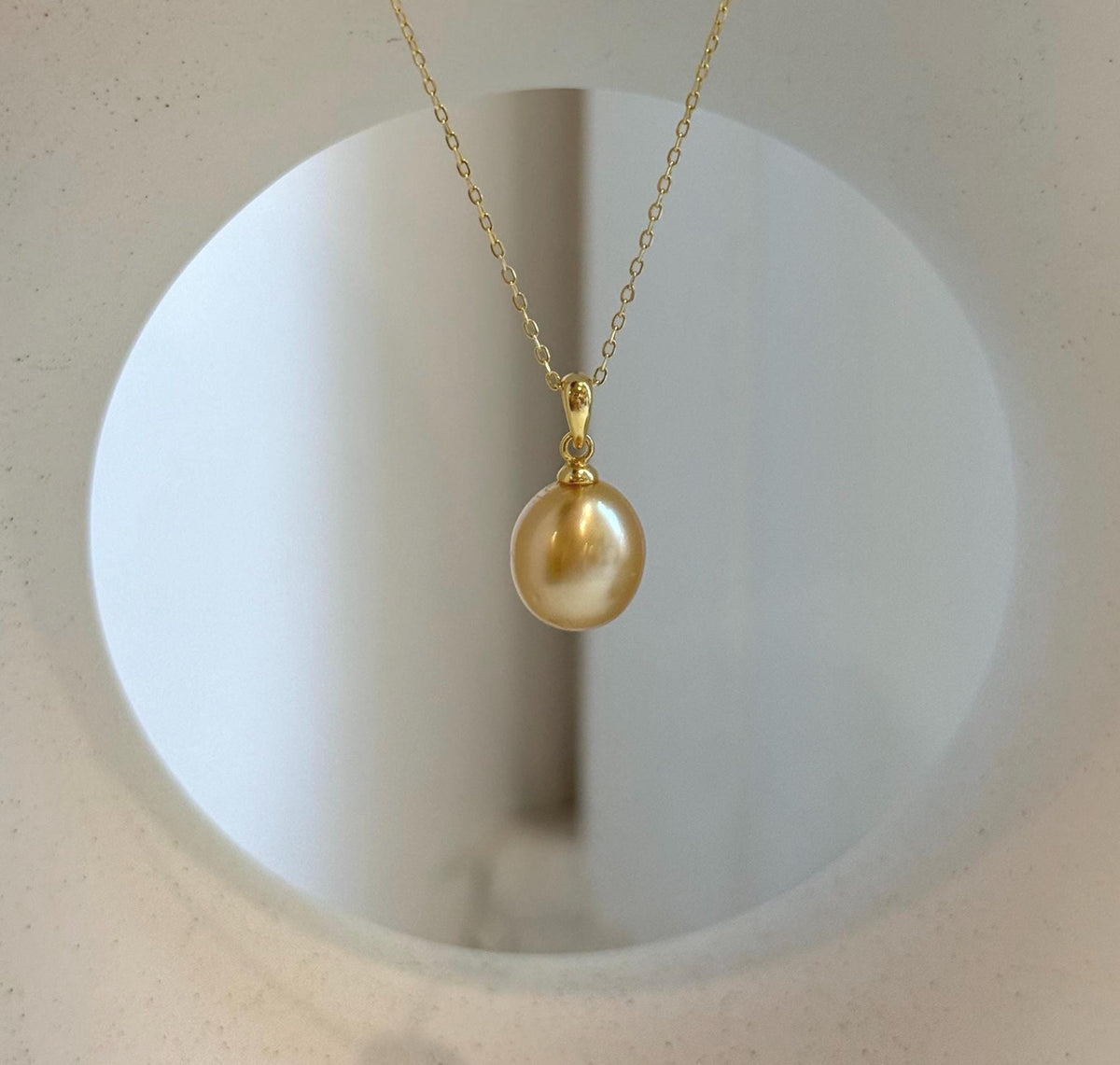 Elly’s 10.2mm South Sea deep tea Gold ocean Pearl pendant: Extreme luster mirrored, 1.9cm high, S925 silver w/ gold plated pendant.