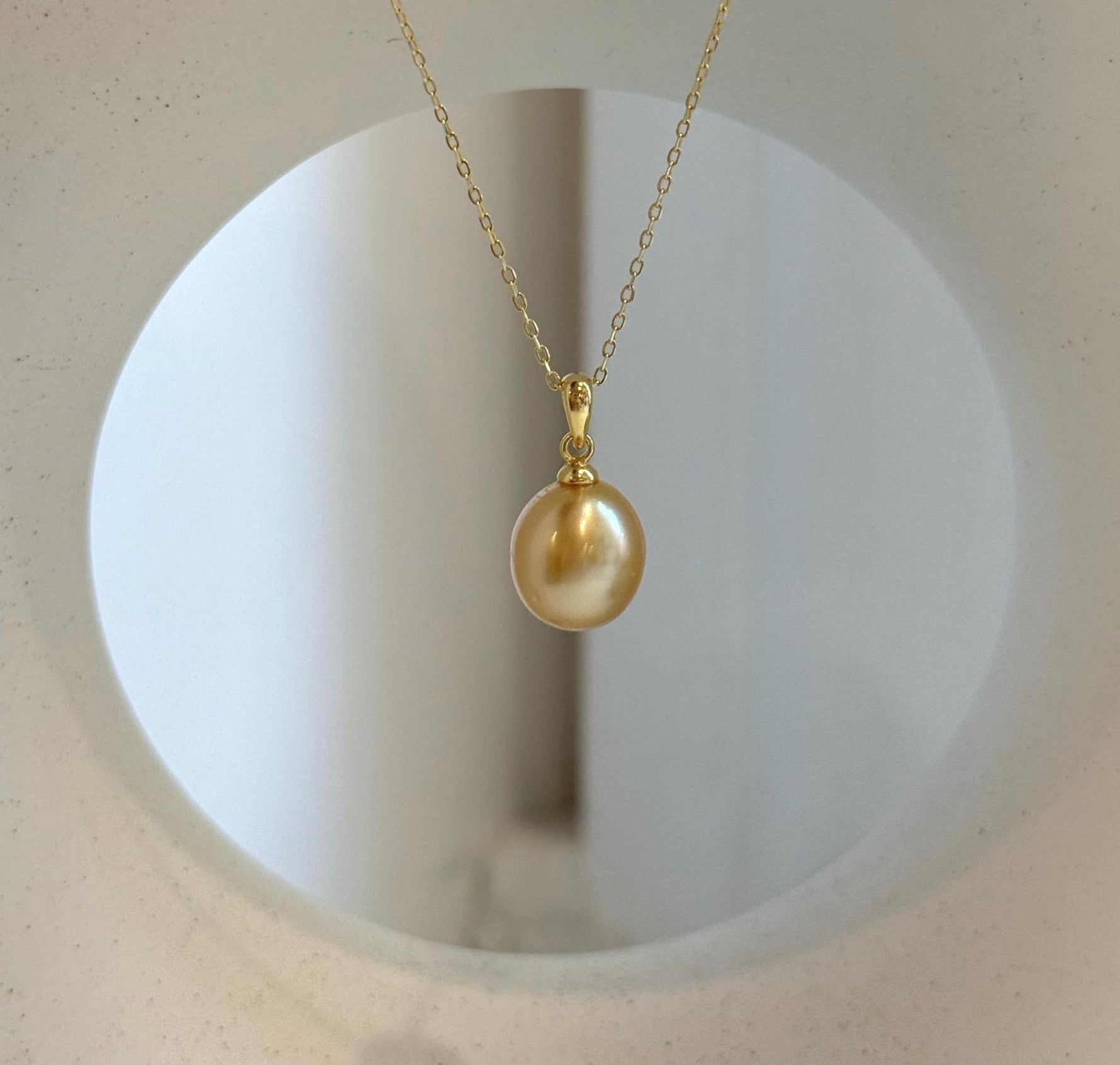 Elly’s 10.2mm South Sea deep tea Gold ocean Pearl pendant: Extreme luster mirrored, 1.9cm high, S925 silver w/ gold plated pendant.