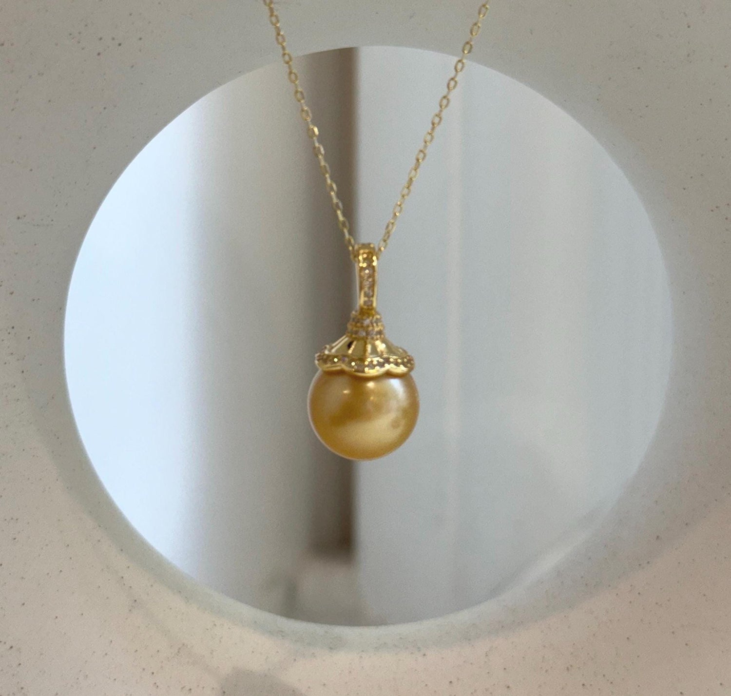 Elly’s 12.6mm South Sea deep Gold ocean Pearl pendant: Extreme luster mirrored, 2.4cm high, S925 silver w/ gold plated pendant.