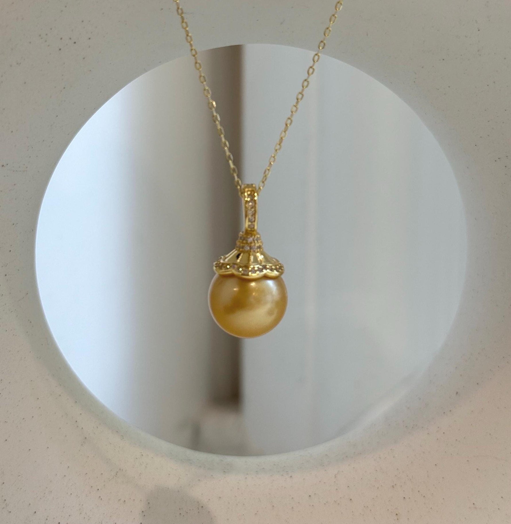 Elly’s 12.6mm South Sea deep Gold ocean Pearl pendant: Extreme luster mirrored, 2.4cm high, S925 silver w/ gold plated pendant.