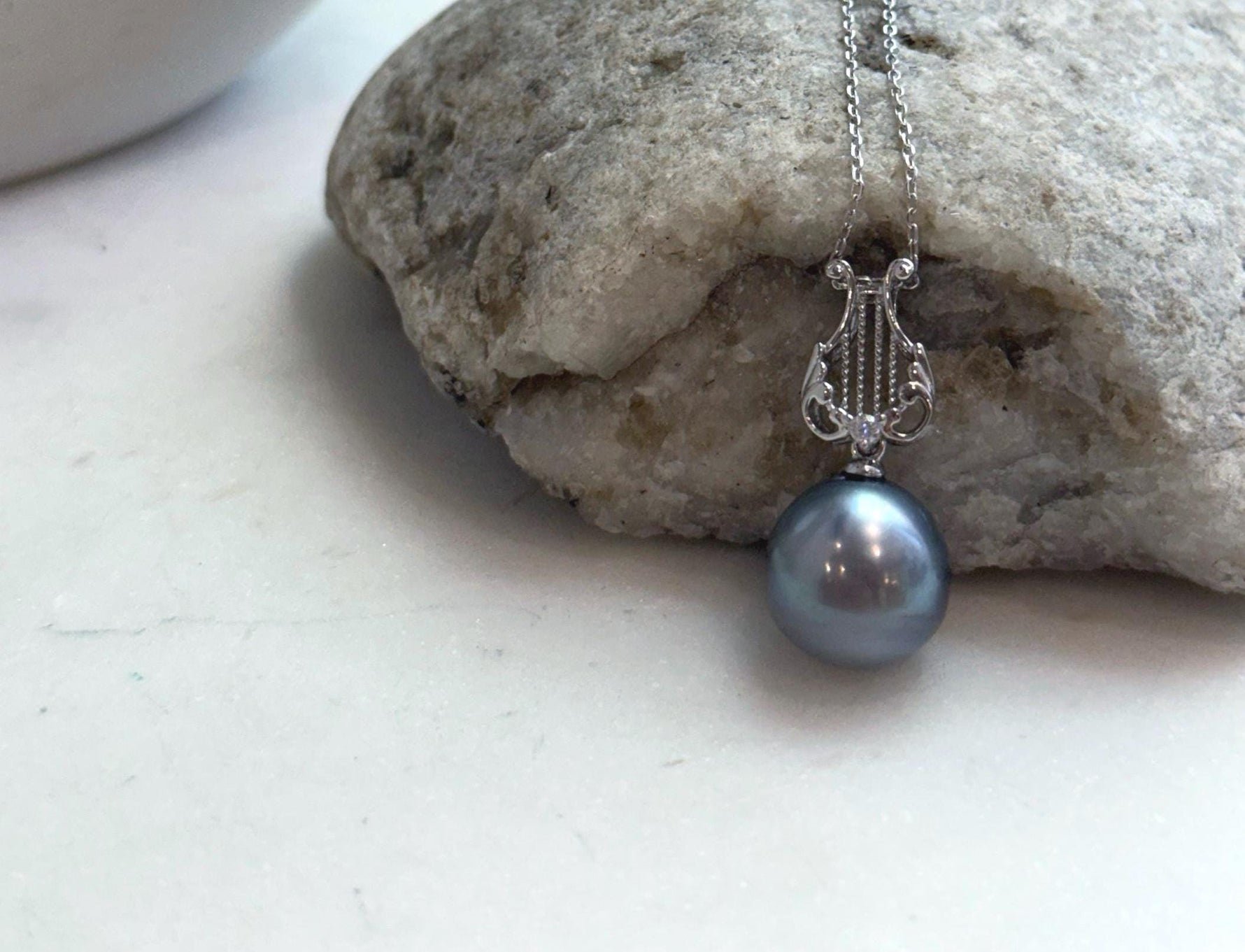 Genuine saltwater Tahitian pearl jewelry featuring exceptional mirror-like luster.