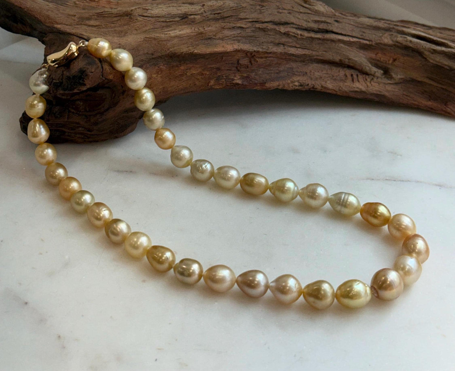 Elly’s 8.4-11.9mm 35pcs Genius natural South sea Golden Ocean Pearls Necklace: Extreme luster, 17.5” knotted, S925 silver necklace strand.