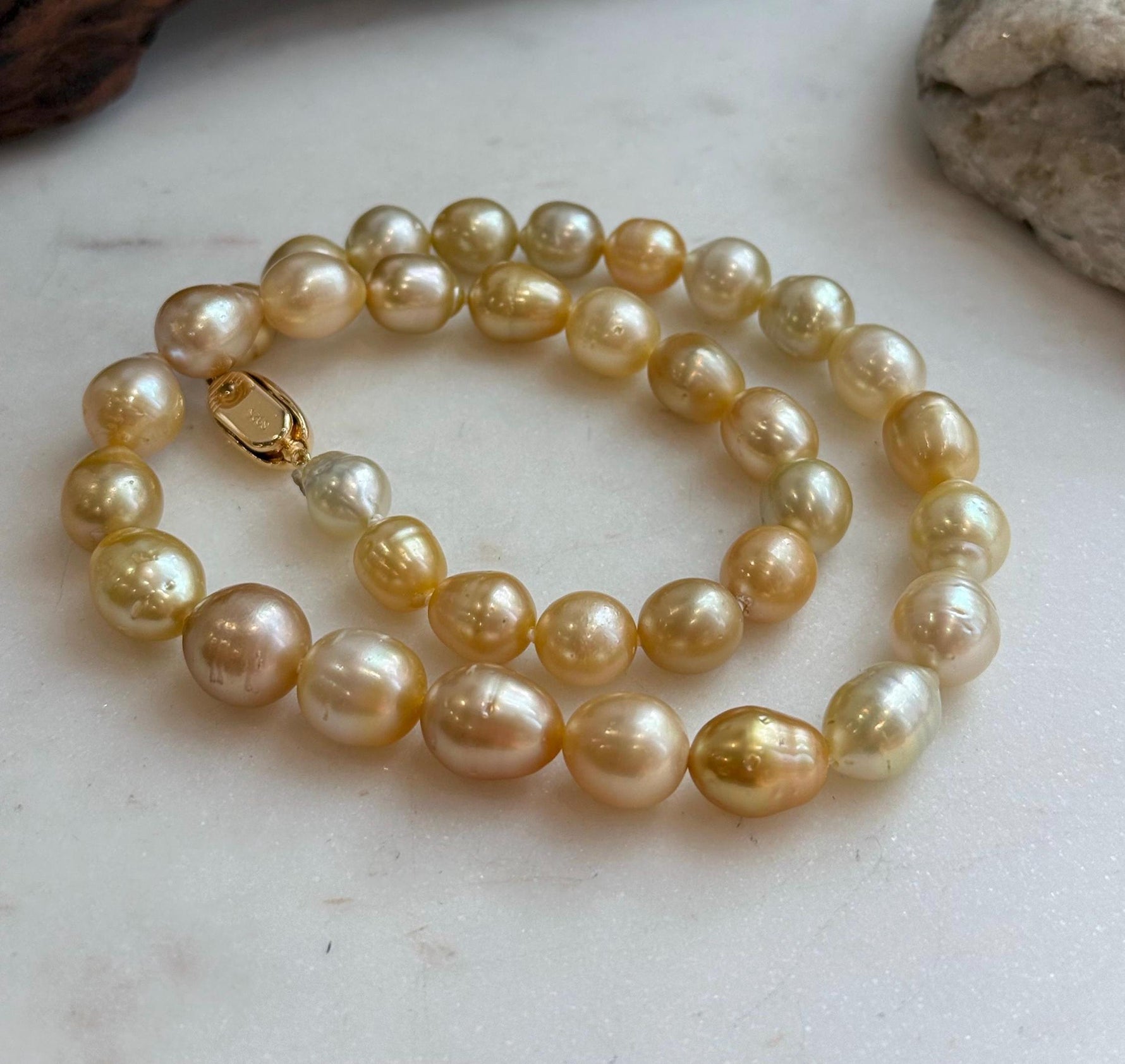 Elly’s 8.4-11.9mm 35pcs Genius natural South sea Golden Ocean Pearls Necklace: Extreme luster, 17.5” knotted, S925 silver necklace strand.