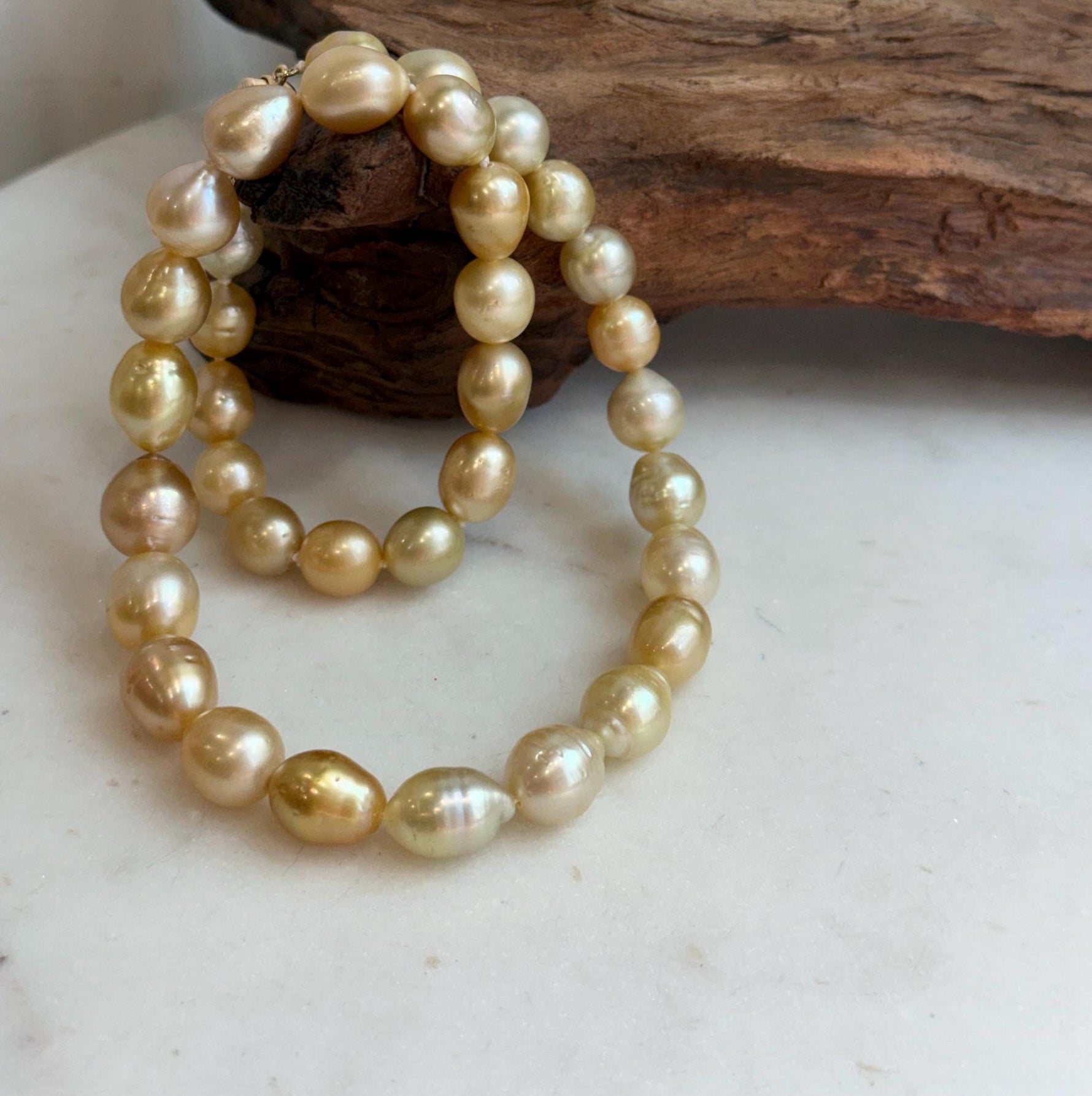 Elly’s 8.4-11.9mm 35pcs Genius natural South sea Golden Ocean Pearls Necklace: Extreme luster, 17.5” knotted, S925 silver necklace strand.