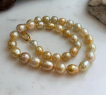 Elly’s 8.4-11.9mm 35pcs Genius natural South sea Golden Ocean Pearls Necklace: Extreme luster, 17.5” knotted, S925 silver necklace strand.