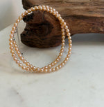 Elly’s 4.1-4.3mm Freshwater Peach gold Pearls Necklace: Extreme luster mirrored, To 18.1”, S925 silver necklace strand.