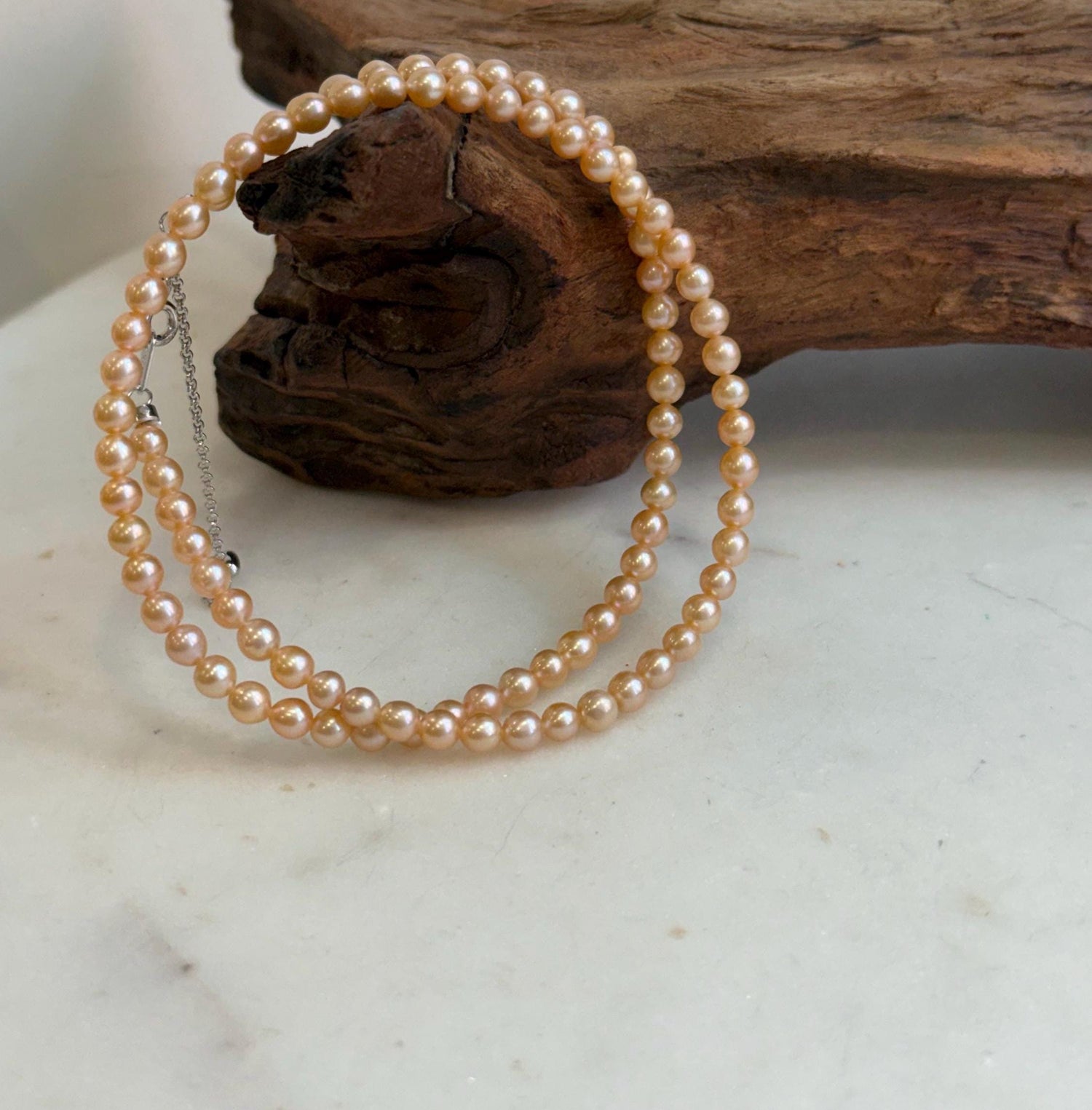 Elly’s 4.1-4.3mm Freshwater Peach gold Pearls Necklace: Extreme luster mirrored, To 18.1”, S925 silver necklace strand.